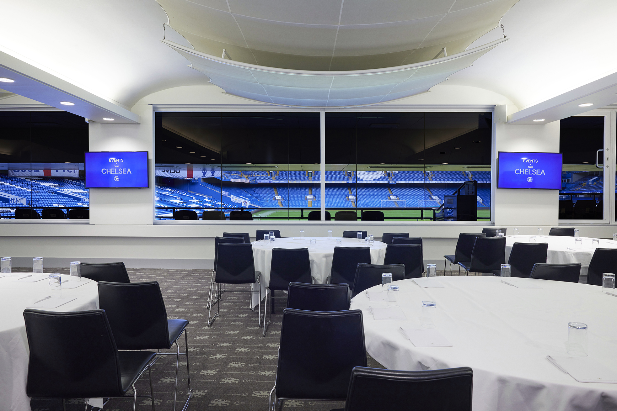 Canoville Suite at Chelsea FC: modern event space with sports field view for corporate meetings. - Banner