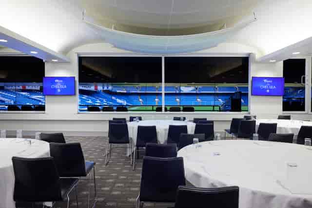 Canoville Suite at Chelsea FC: modern event space with sports field view for corporate meetings.