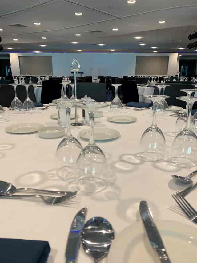 Elegant dining setup in Chelsea FC's Drake and Harris Suites for formal events.
