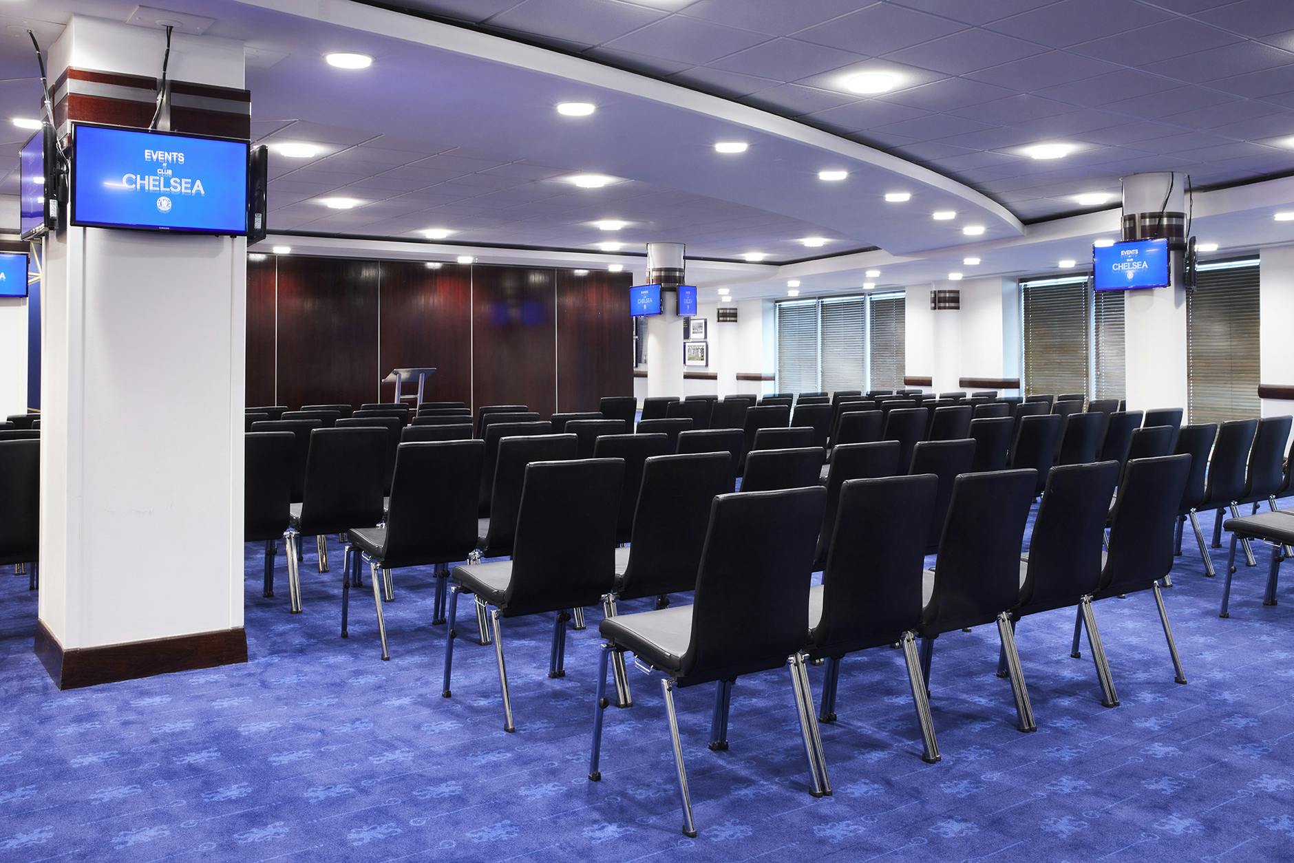 Bonnetti Suite meeting space with black chairs, ideal for corporate events and conferences.