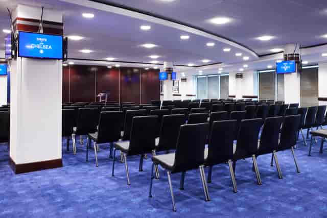 Bonnetti Suite meeting space with black chairs, ideal for corporate events and conferences.