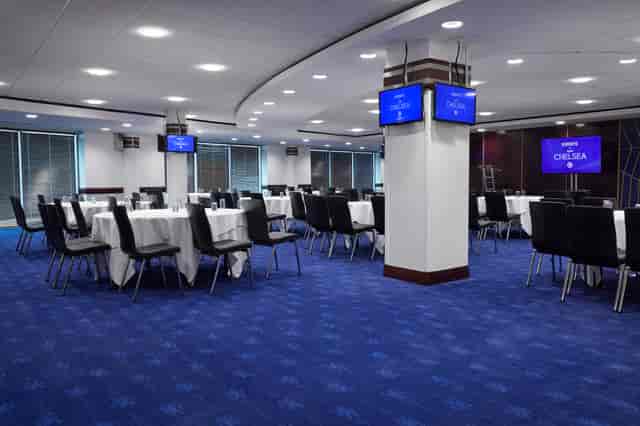 Bonnetti Suite at Chelsea FC, elegant event space with round tables for corporate meetings.