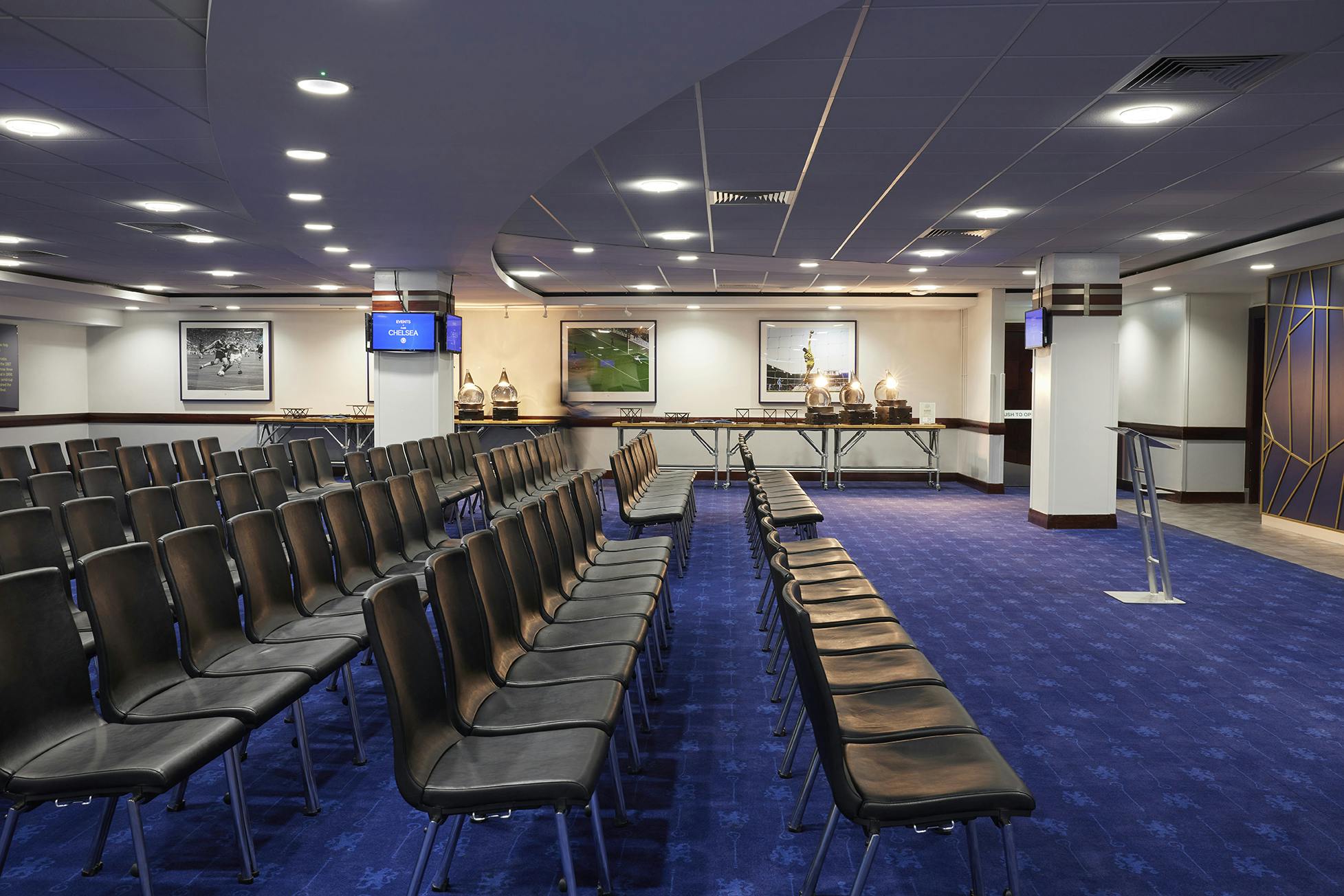 Tambling Suite at Chelsea FC, elegant meeting space with black chairs for conferences.