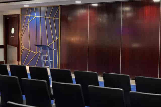 Tambling Suite at Chelsea FC: modern event space with podium, ideal for meetings and conferences.