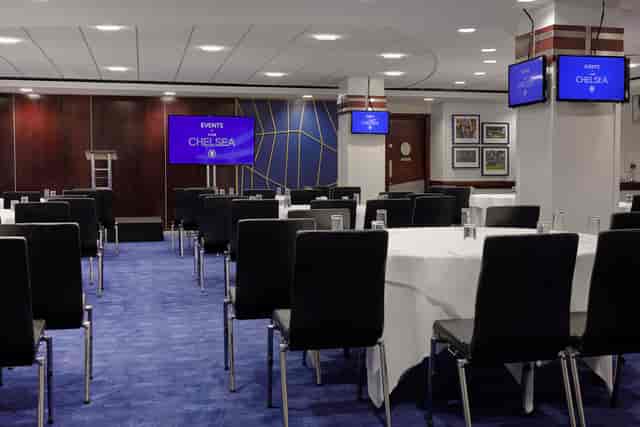 Tambling Suite at Chelsea FC: modern meeting room for corporate events with dual screens.
