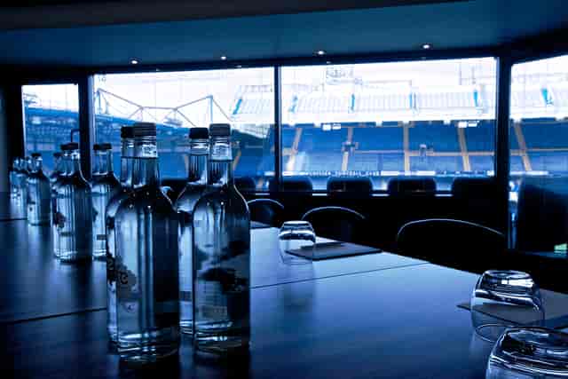 Millennium Suite at Chelsea FC: sleek meeting room with stadium view for corporate events.