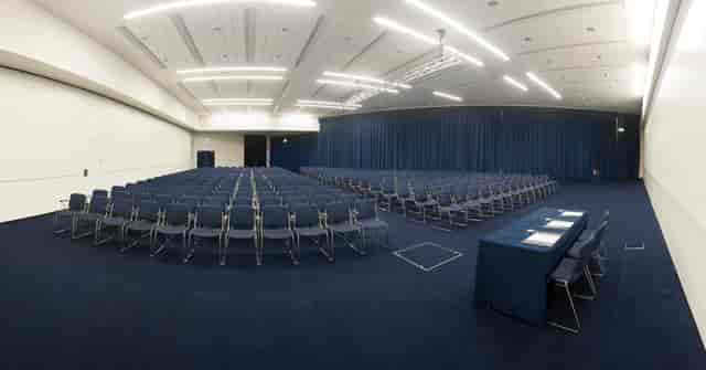 Spacious event venue in Manchester Central set for a large conference with neat seating.