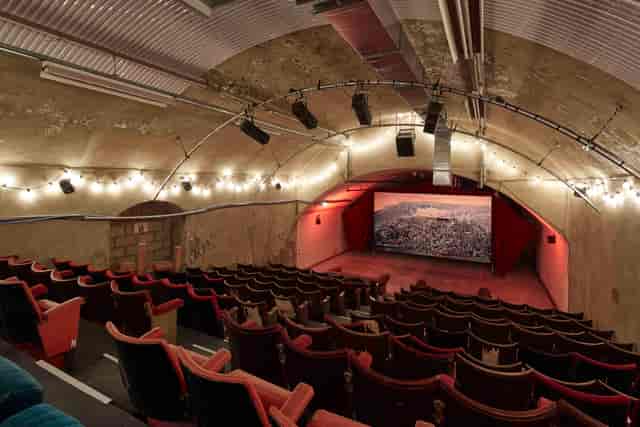 The Vaults Theatre: vintage cinema with arched ceiling, ideal for film screenings and events.