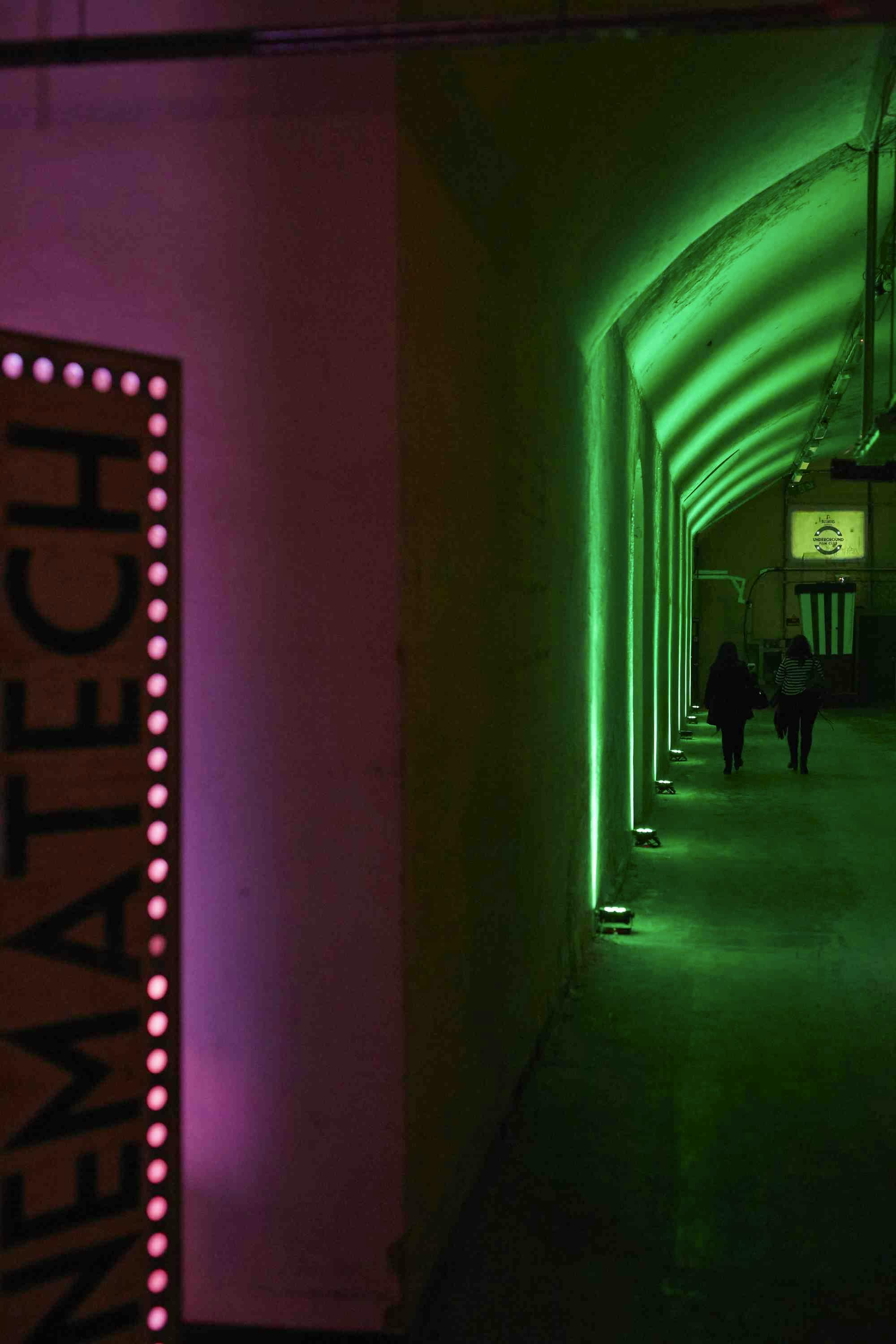 Modern event space at The Vaults Theatre with vibrant lighting for tech conferences.