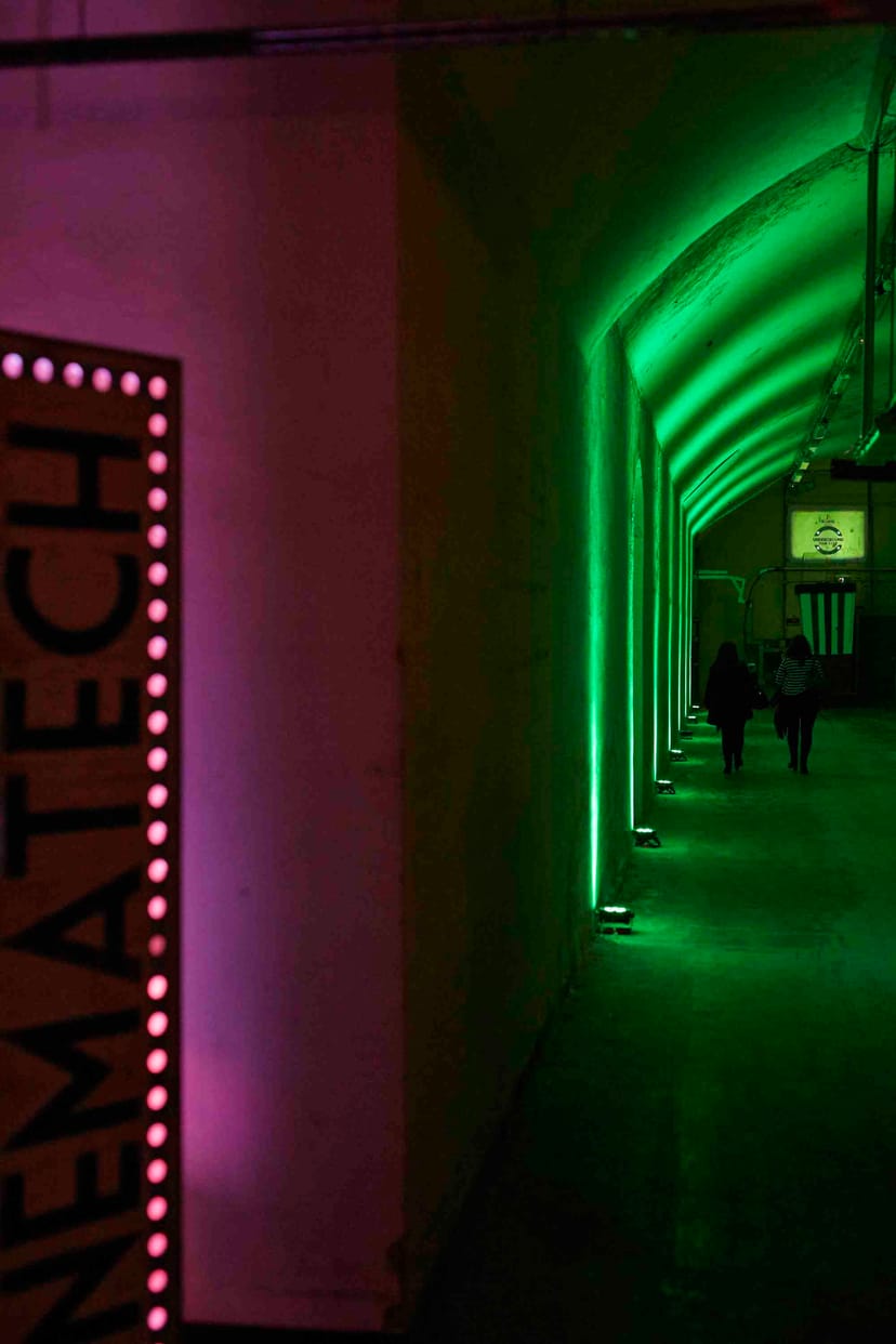 Modern event space at The Vaults Theatre with vibrant lighting for tech conferences.