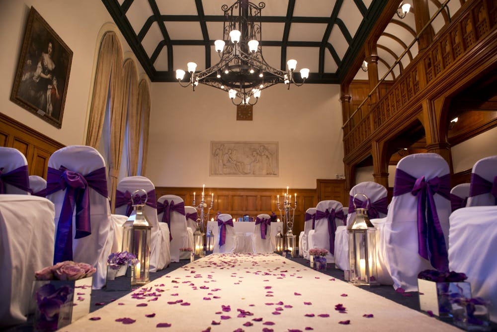 Whitworth Building wedding venue with elegant chairs and romantic ambiance.