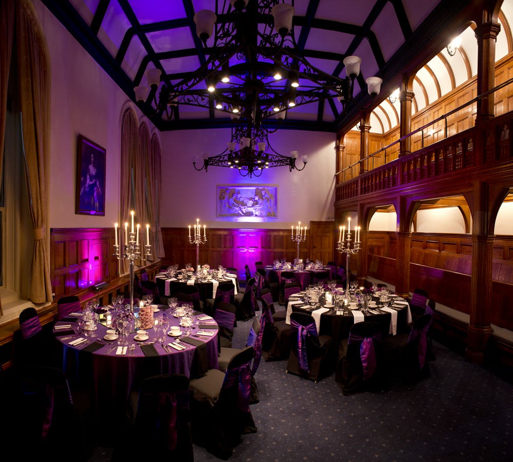 Elegant Whitworth Building banquet hall with purple decor for gala dinners and corporate events.