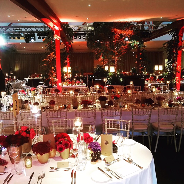 Elegant event space at Bluebird Chelsea with floral centerpieces for galas and formal dinners. - Banner