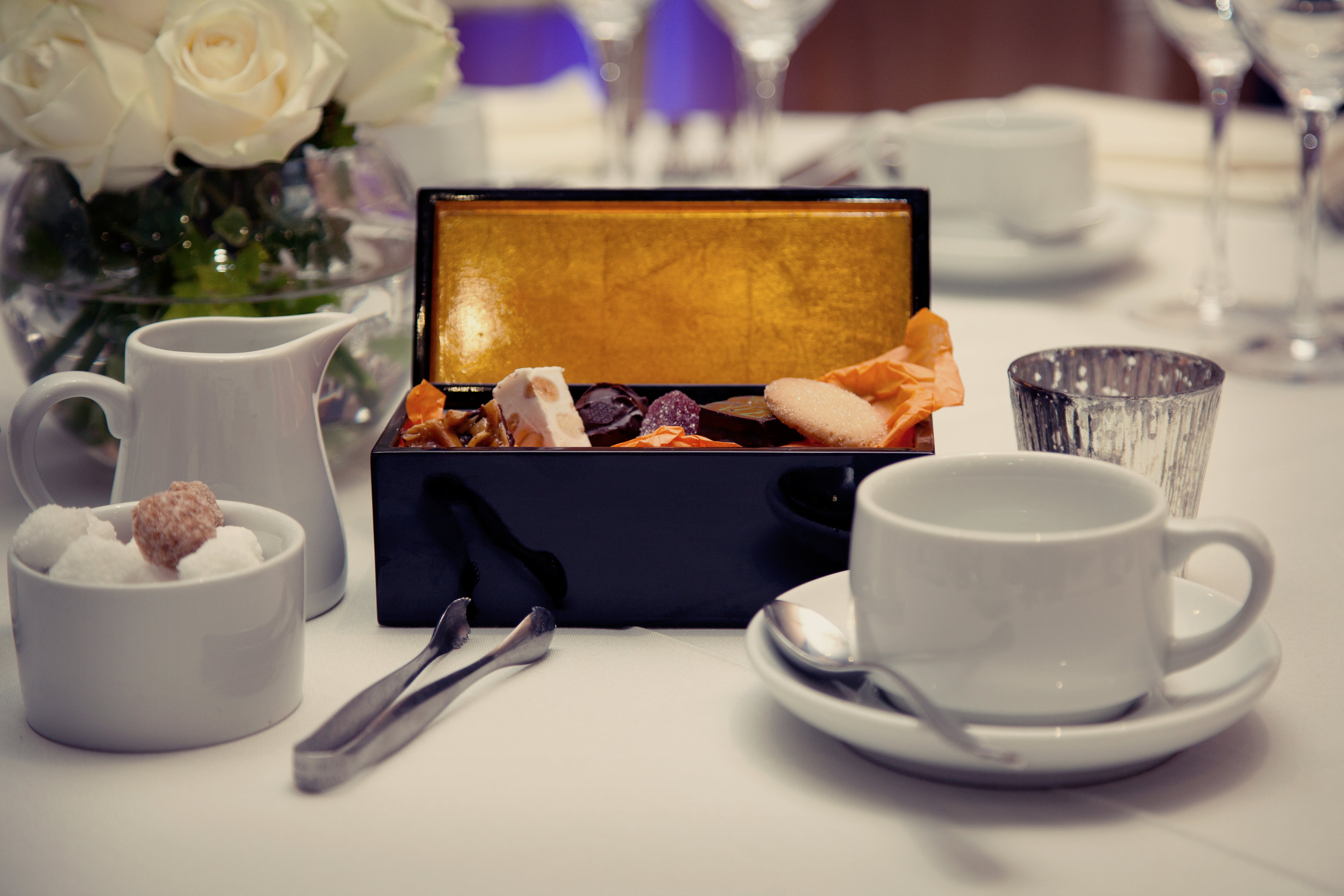 Elegant table setting with dessert box for corporate meetings and upscale events. - Banner