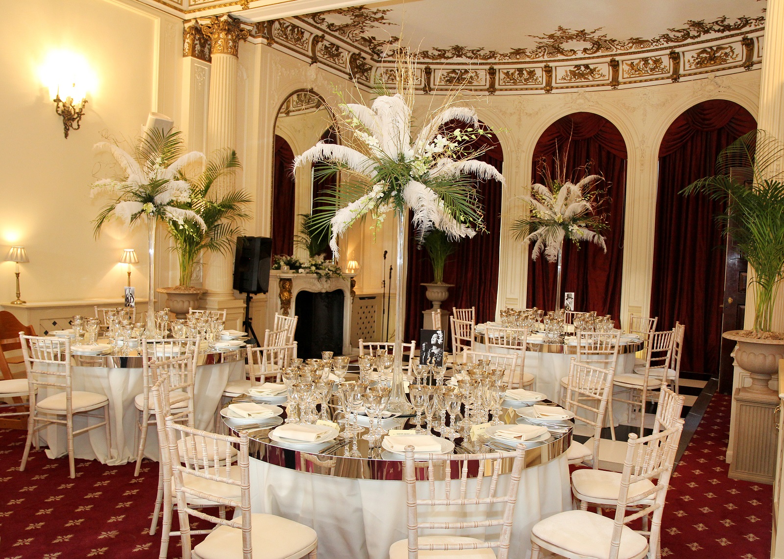 Elegant banquet room with floral centerpieces for weddings and corporate events. - Banner