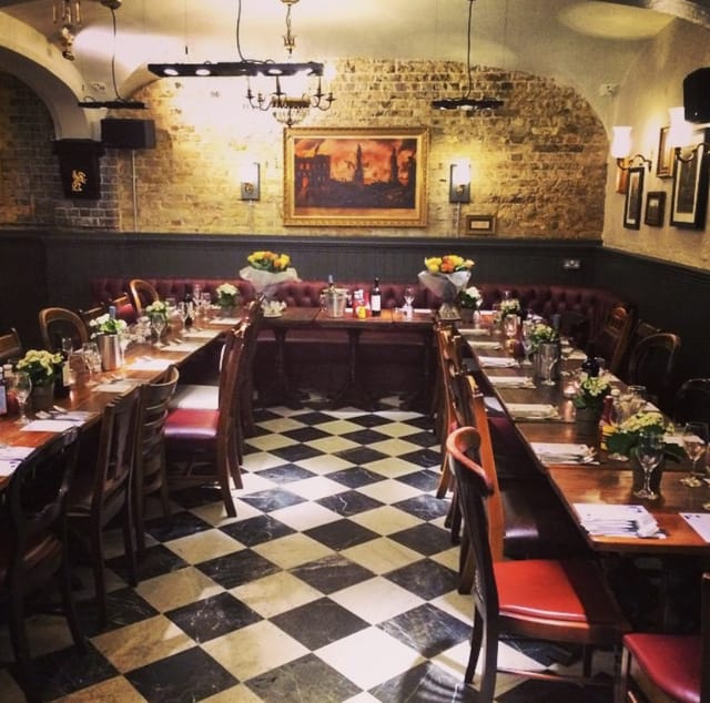 Martha's Cellar Bar dining space with floral centerpieces for events and gatherings.