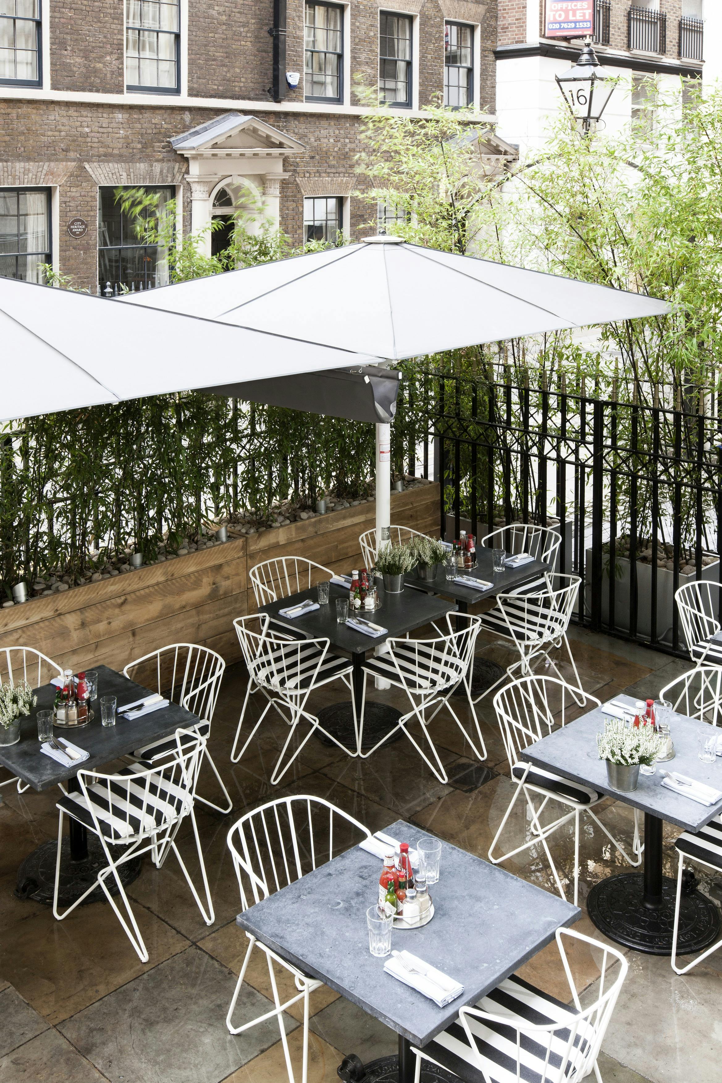 Stylish outdoor dining area at Terrace in Fish Market, ideal for casual meetings and events.