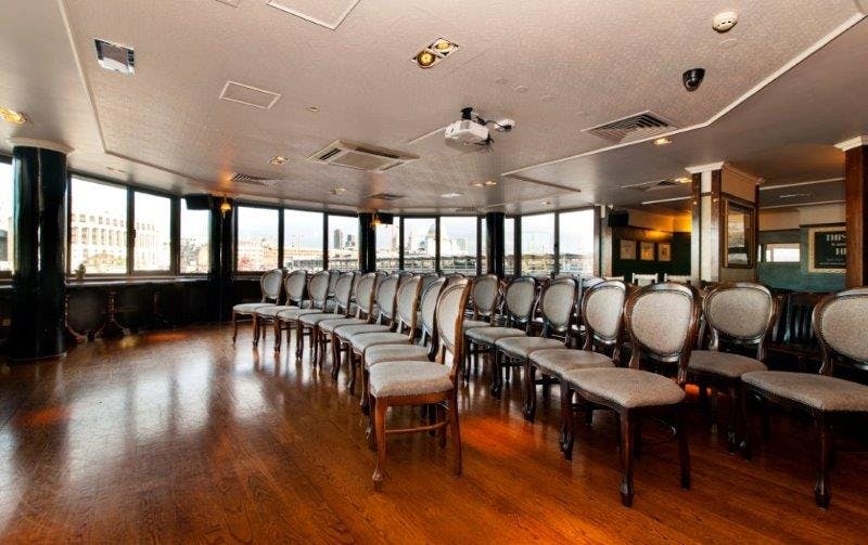 Thomas Doggett Bar meeting space with elegant chairs, ideal for workshops and presentations.