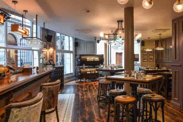 Stylish venue with warm lighting for intimate meetings and events in Jamie's Adams Court.