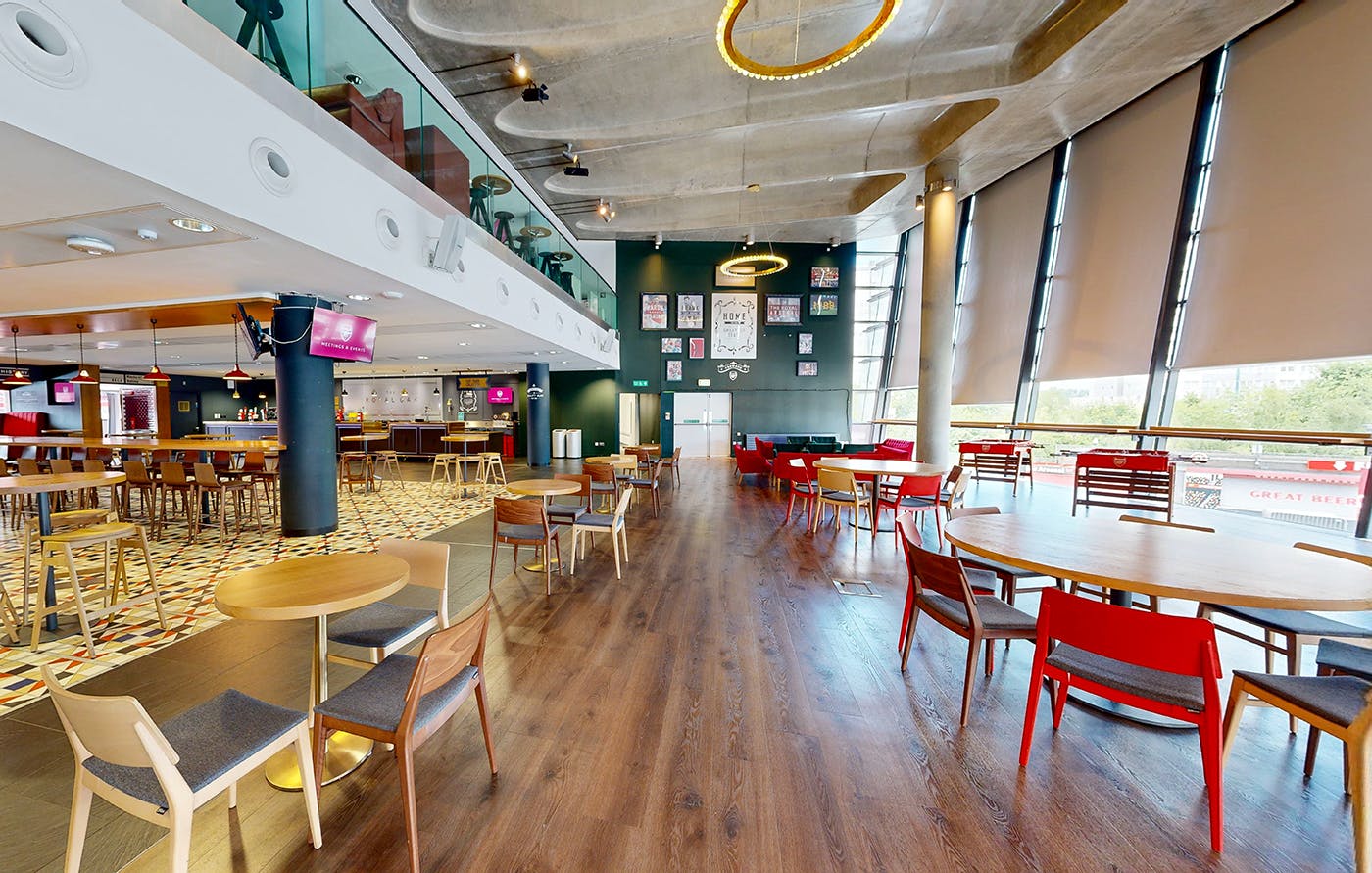 Royal Oak at Emirates Stadium: modern event venue with natural light for networking and gatherings.