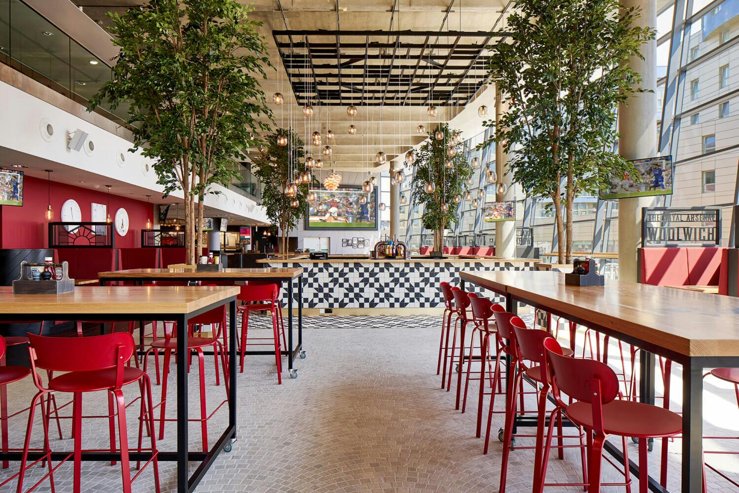 Dial Square at Emirates Stadium: modern venue with vibrant red chairs for events and meetings.