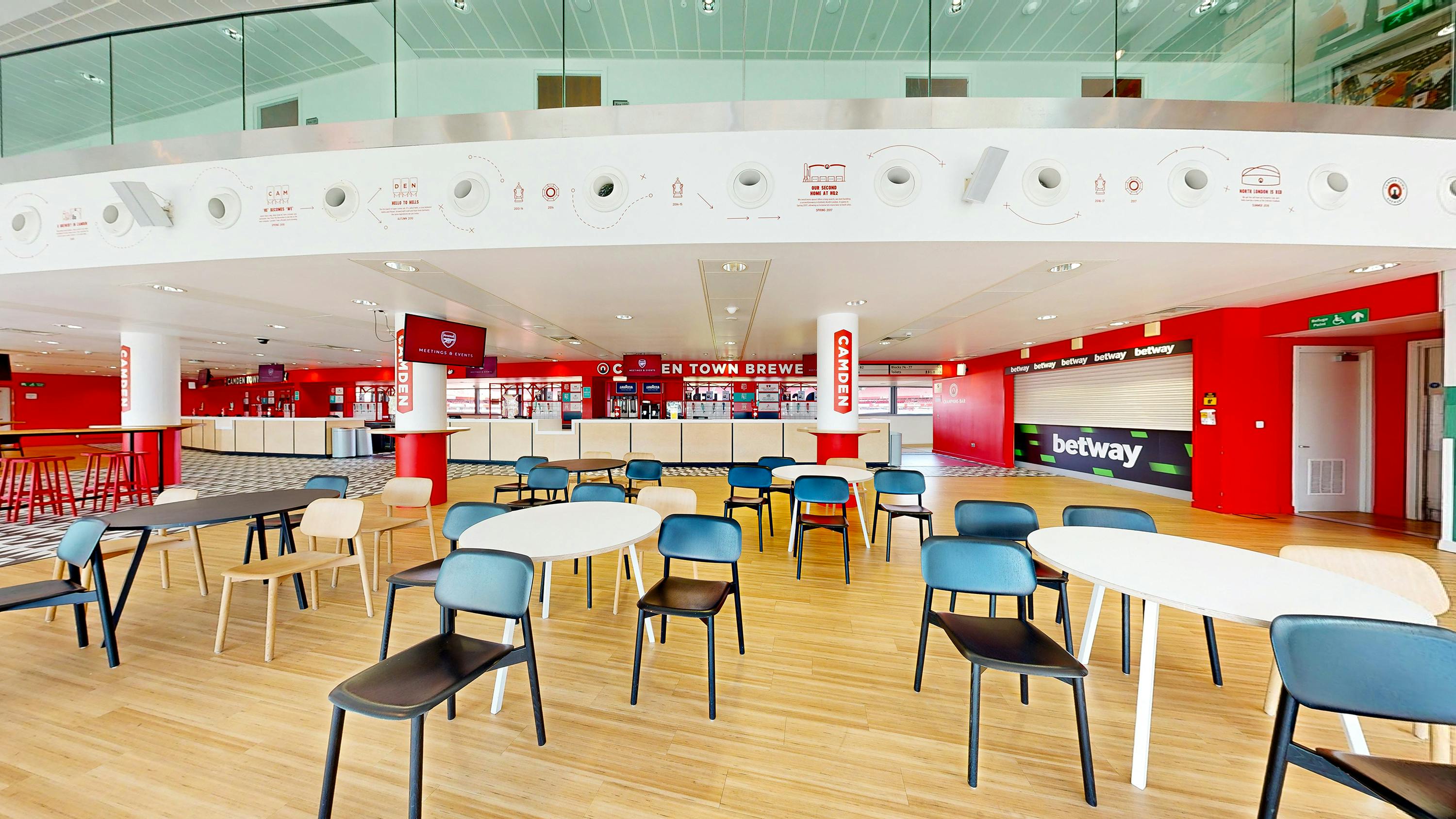 Champions event space at Arsenal FC, featuring flexible seating and digital screens.