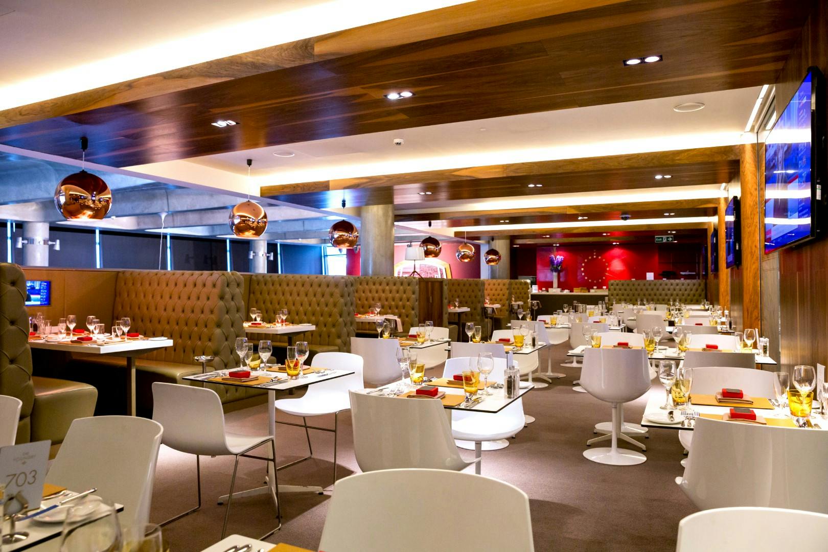 Modern restaurant at Emirates Stadium, ideal for events with elegant decor and seating.