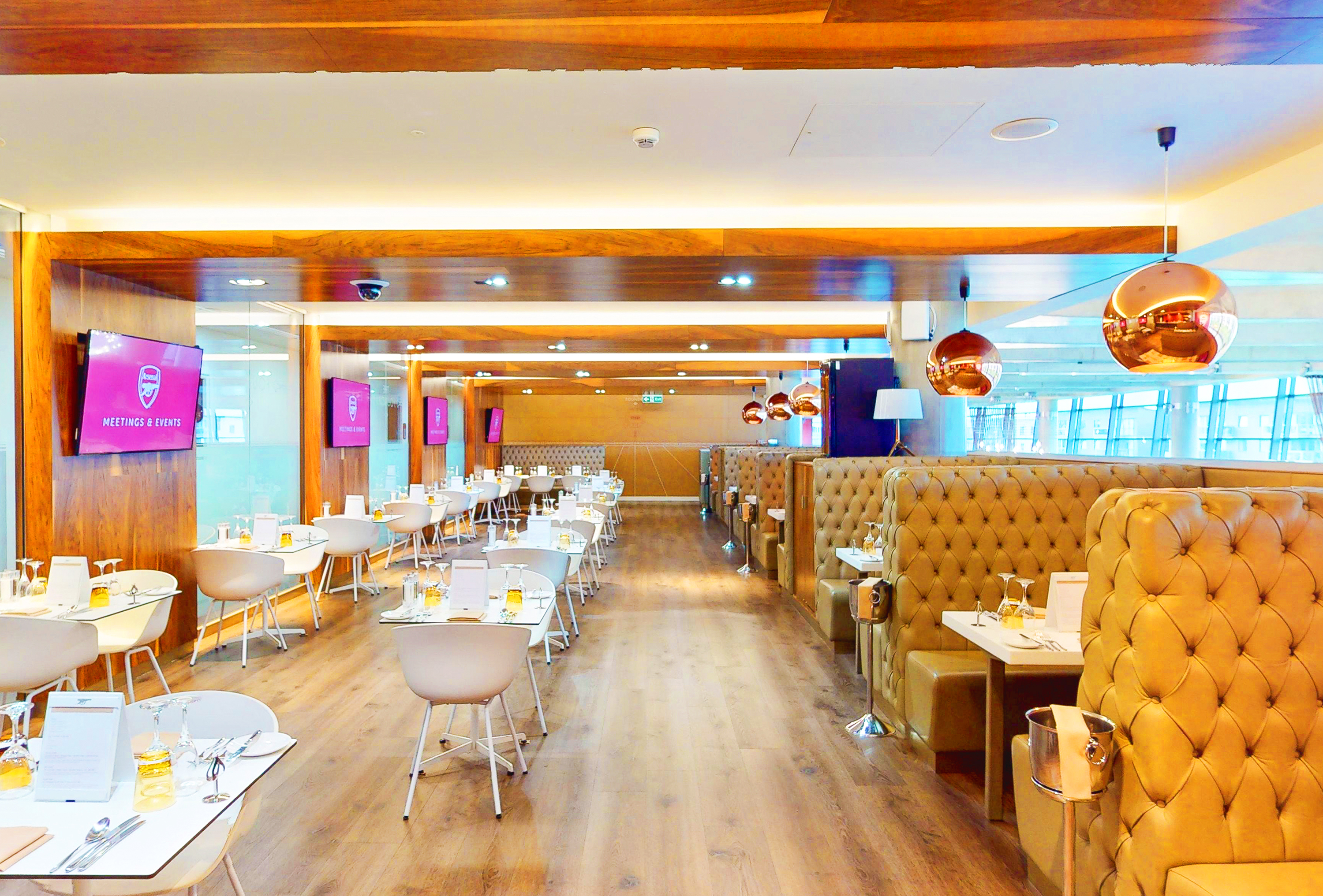 Modern restaurant at Arsenal's Emirates Stadium, ideal for corporate events and meetings. - Banner