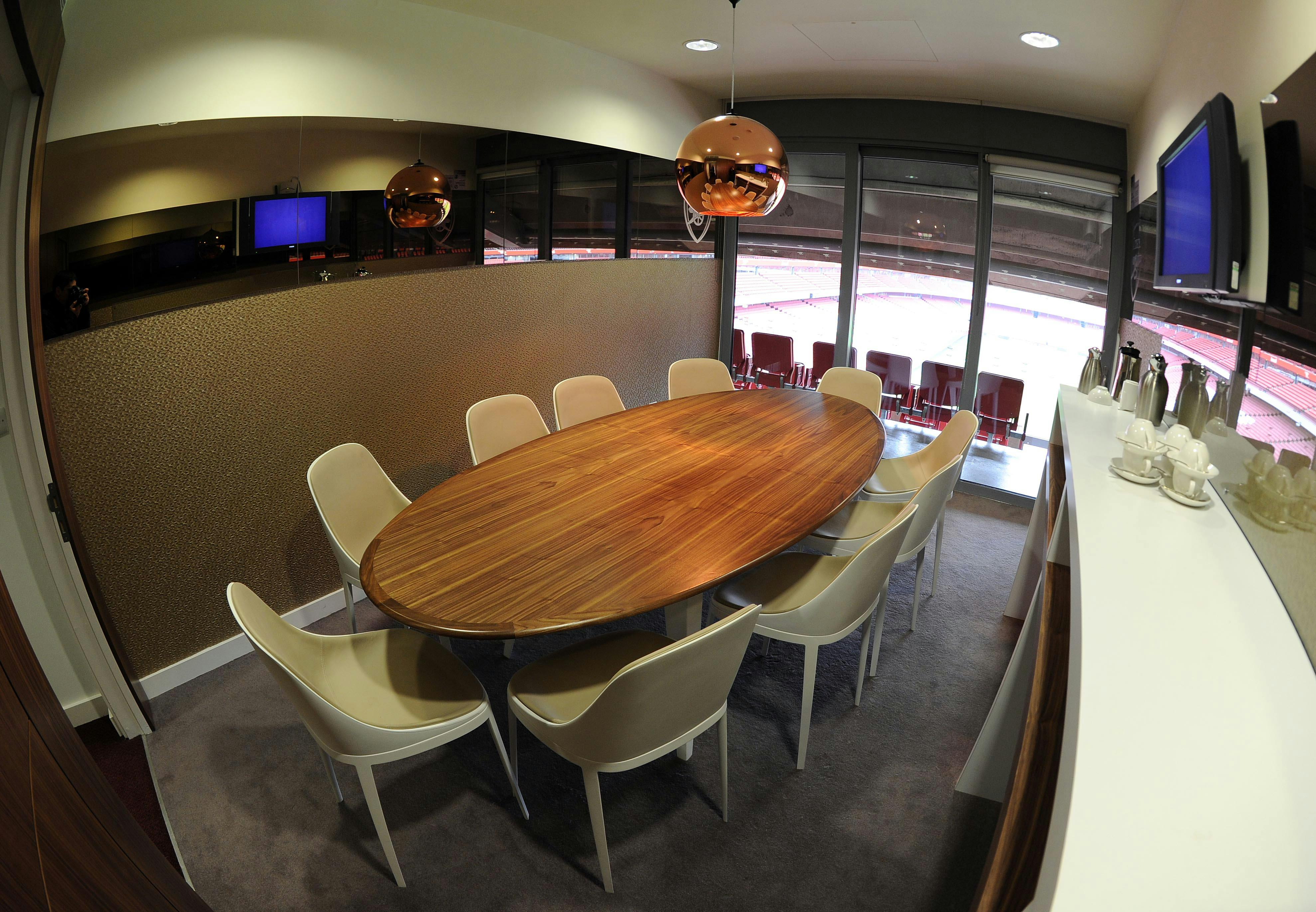 Executive Box at Emirates Stadium: modern meeting room with oval table for events.