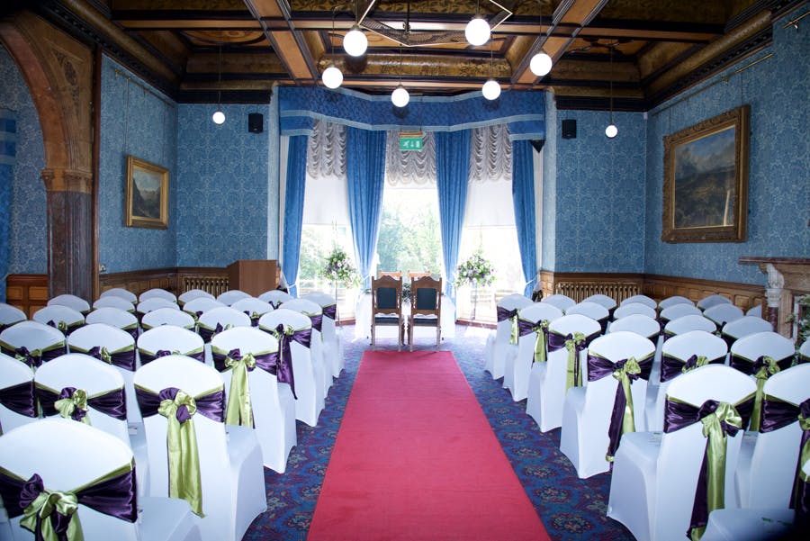 Elegant Highbury Hall venue with blue wallpaper, ideal for weddings and formal gatherings.