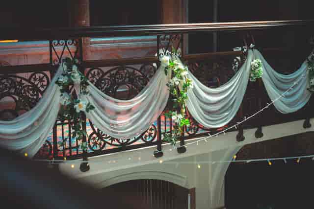 Elegant balcony with floral decor at Highbury Hall, perfect for weddings and upscale events.