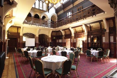 Elegant Main Hall in Highbury Hall, featuring round tables for corporate events and banquets.