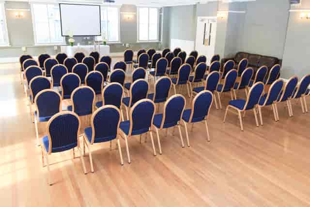 Presidential Suite at The London Irish Centre, blue chairs for meetings and presentations.