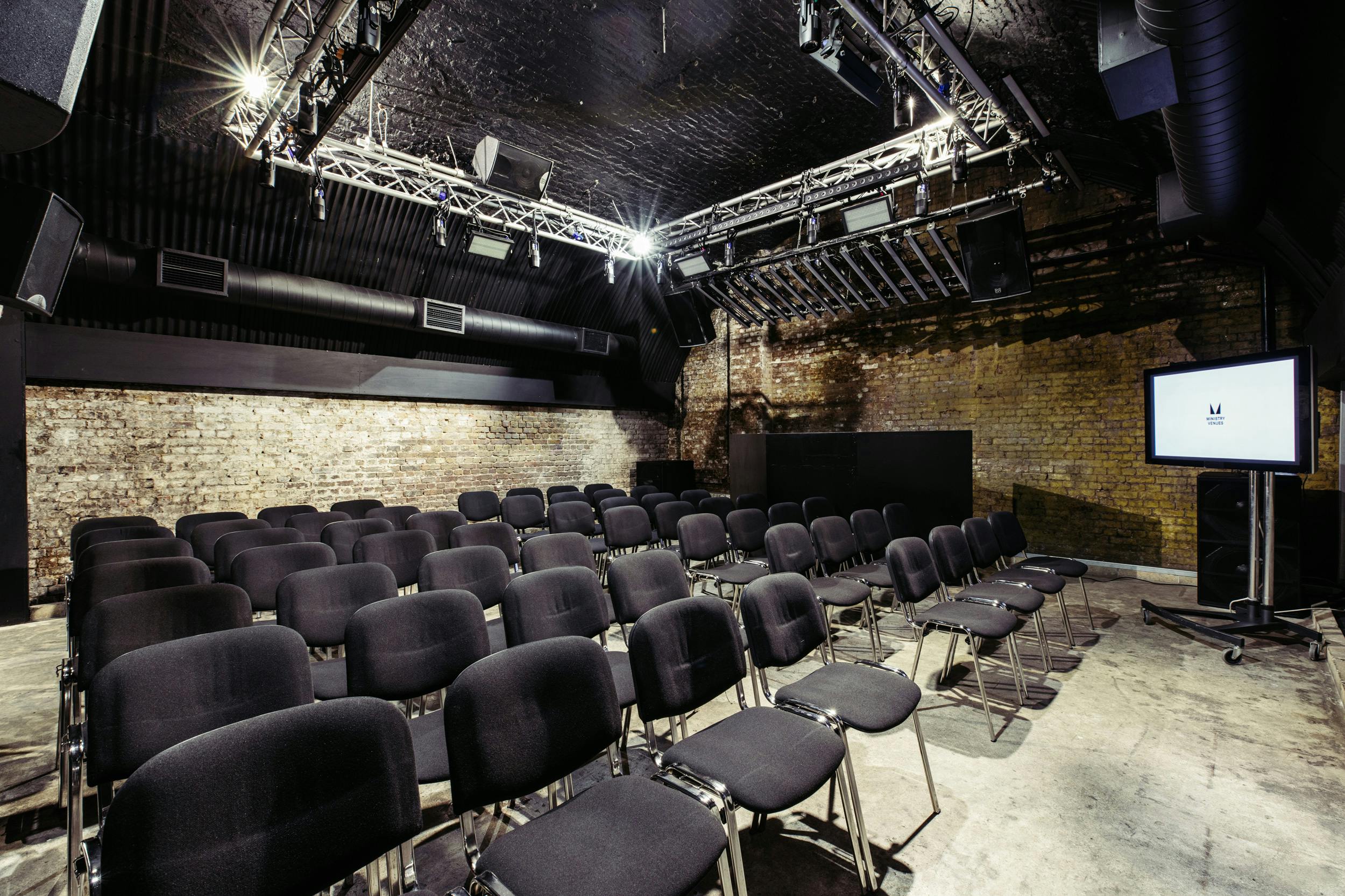 The Baby Box at Ministry of Sound, set for a corporate seminar with black chairs.