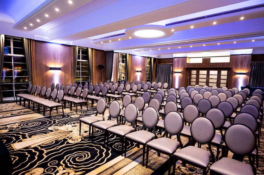 Hall of India conference space with elegant chairs and modern decor for seminars.