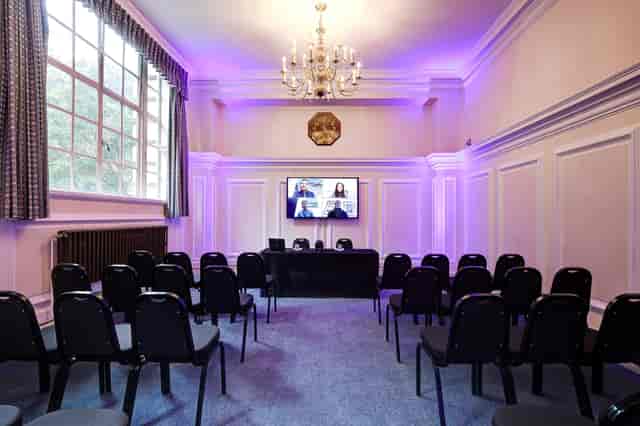 Dinsdale Young in a stylish hybrid event meeting room at Central Hall Westminster.