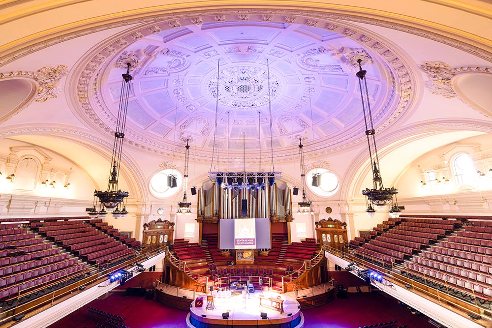 Great Hall in Central Hall Westminster with ornate ceiling, ideal for conferences and performances.