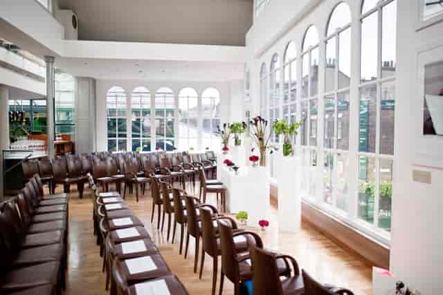 Elegant event space with semi-circle seating, ideal for corporate meetings and gatherings.