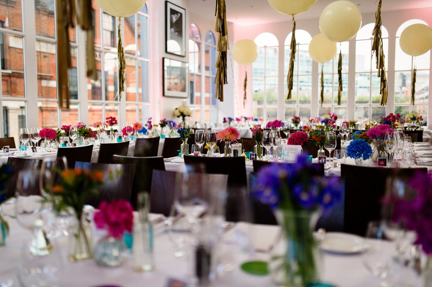 Elegant event space with floral centerpieces, perfect for celebrations and corporate events.