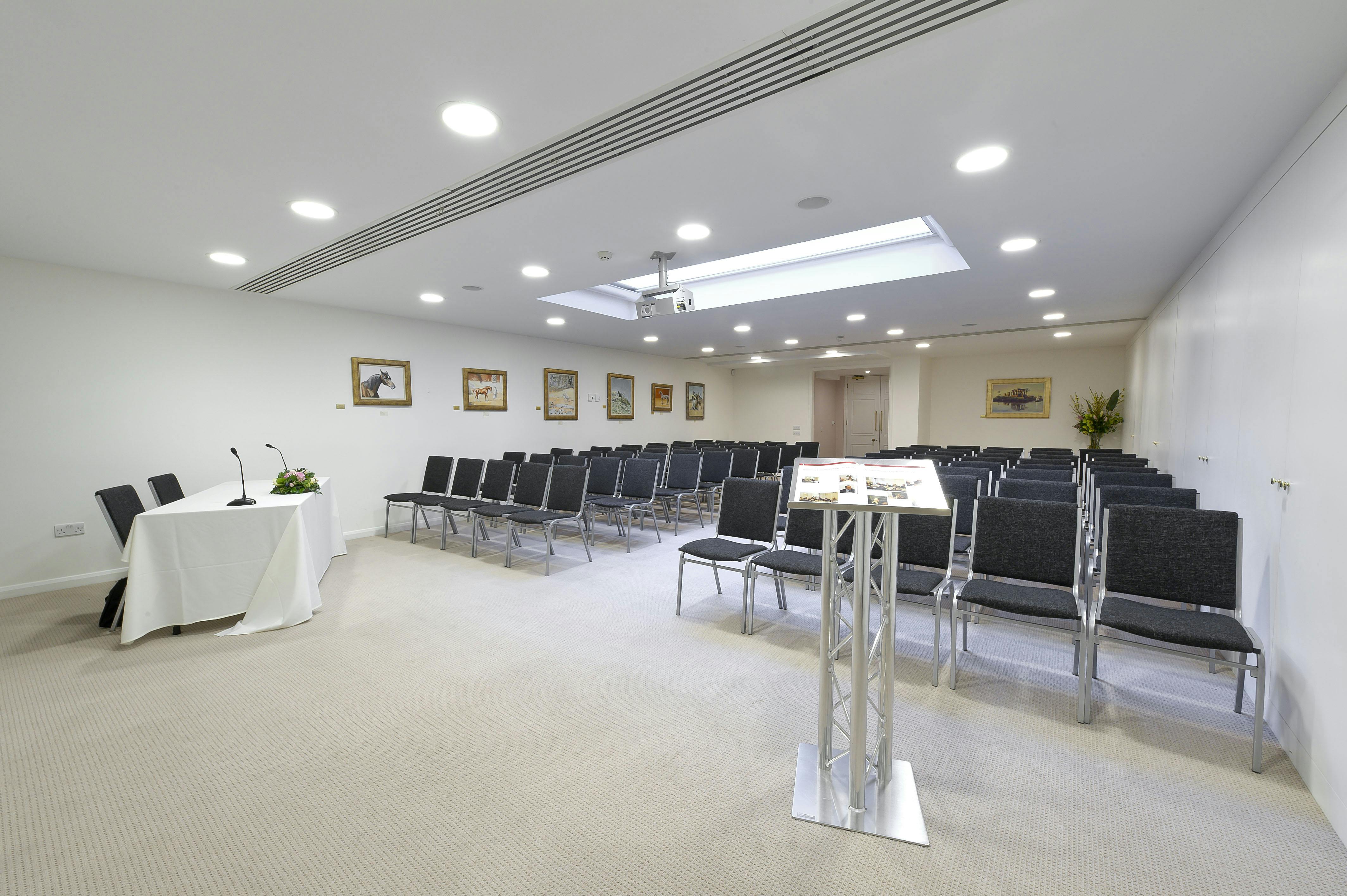 Ivory Suite meeting room with elegant decor, ideal for presentations and workshops.