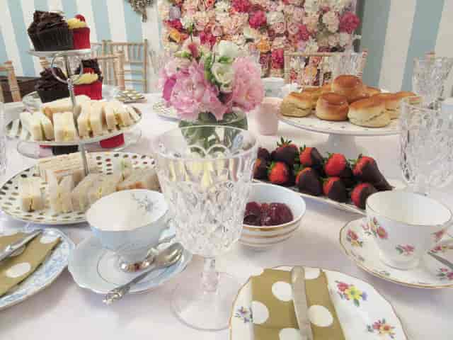 Elegant tea party table with delicate china, perfect for social gatherings and networking.