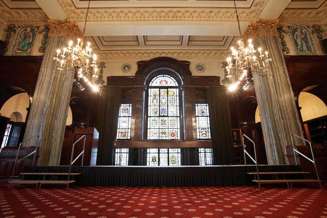 Elegant event space with chandeliers and stained glass at 113 Chancery Lane.