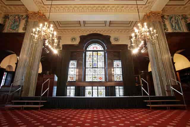 Elegant event space with chandeliers and stained glass at 113 Chancery Lane.