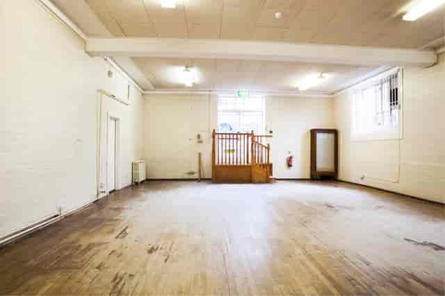 Spacious Storrow Room at Cecil Sharp House, ideal for events with natural light and wooden floor.