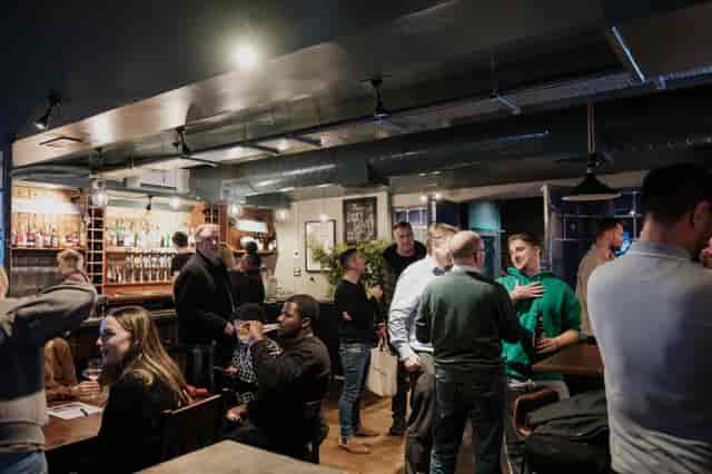 Vibrant networking event at Cellar Bar, cozy venue with engaging atmosphere.