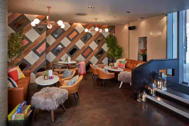 Stylish lounge with modern decor, perfect for networking events and informal meetings.