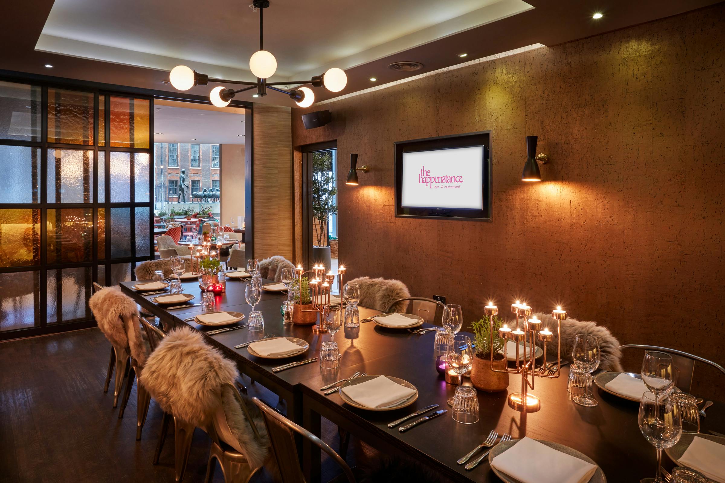 Elegant dining table setup in The Happenstance for corporate dinners and intimate gatherings.