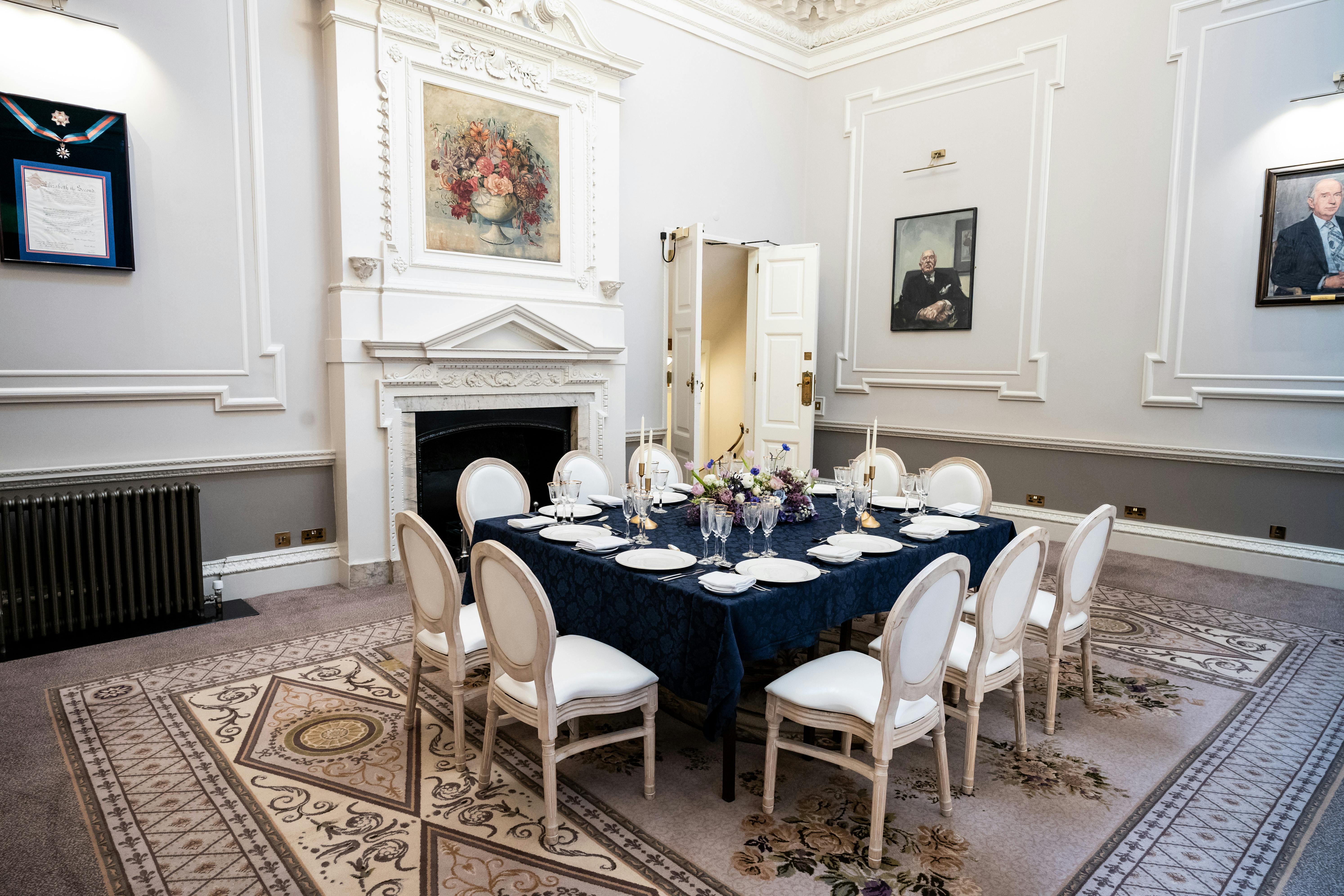 Wrench Room at Six Park Place: elegant round table set for intimate meetings and events.