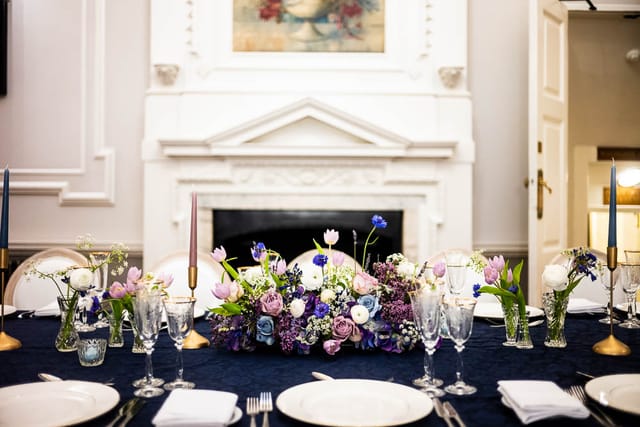 Elegant dining table with floral centerpiece for sophisticated events at Wrench Room.