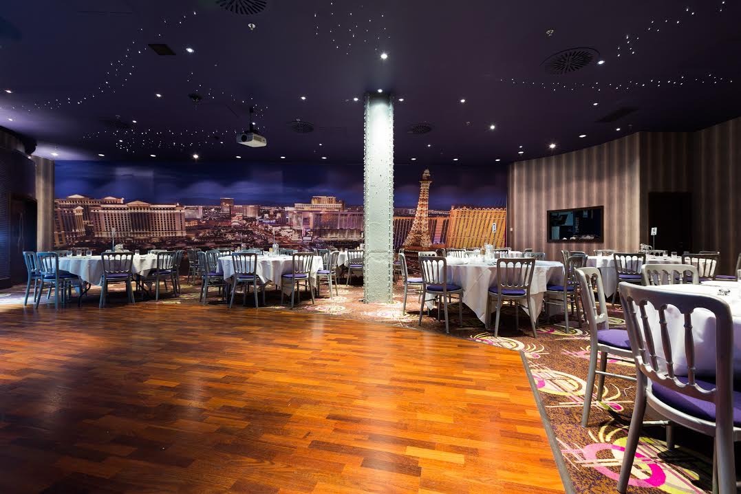 Stylish Private Events Suite in Manchester 235 with elegant round tables for corporate gatherings. - Banner